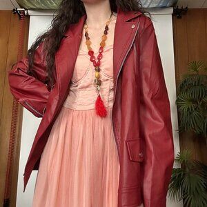 Red faux leather jacket with silver hardware